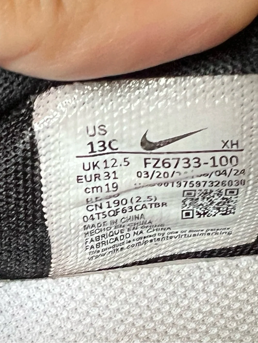 Nike Kids White and Black Sneakers with Gold Accents